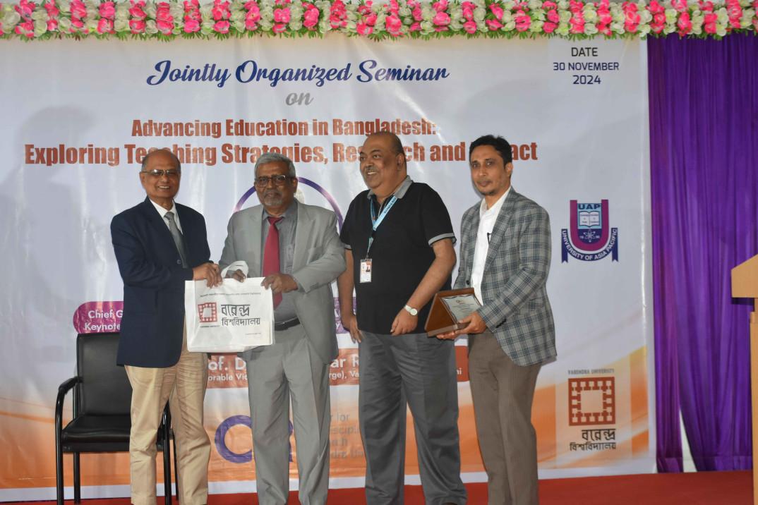 Token of Appreciation to Prof. Dr. Qumrul Ahsan ( Honorable Vice Chancellor, University of Asia Pacific, Dhaka) at the Seminar: Advancing Education in Bangladesh- Exploring Teaching Stratigies, Research and Impact